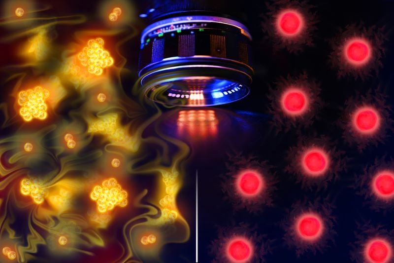 image of free ranage atoms , a lens with stylized atoms, yellow on the left and red on the right